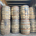 Whiskey barrels stacked high